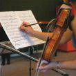Masterclass van Herman Krebbers. Een leerling maakt een aantekening